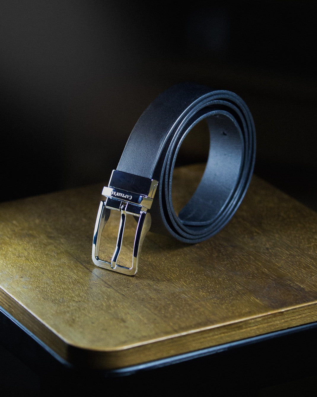 black leather belt with silver buckle
