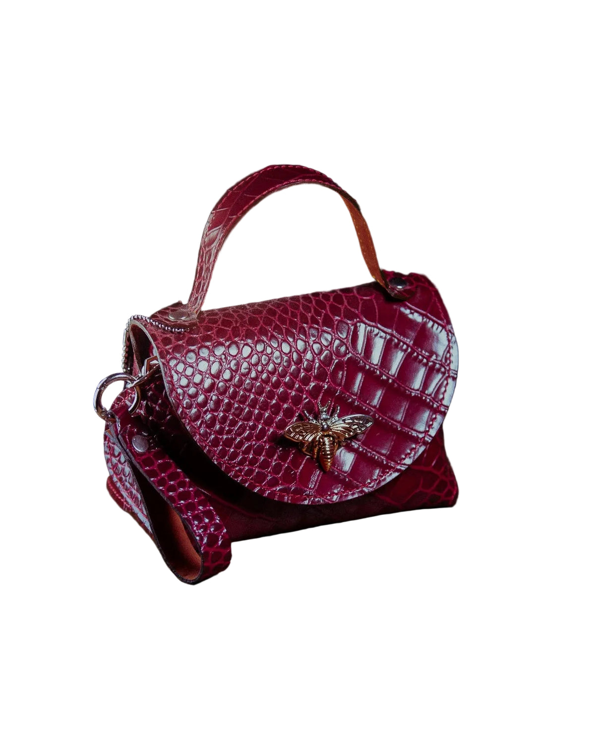 leather micro bag on a wooden surface on a dark background