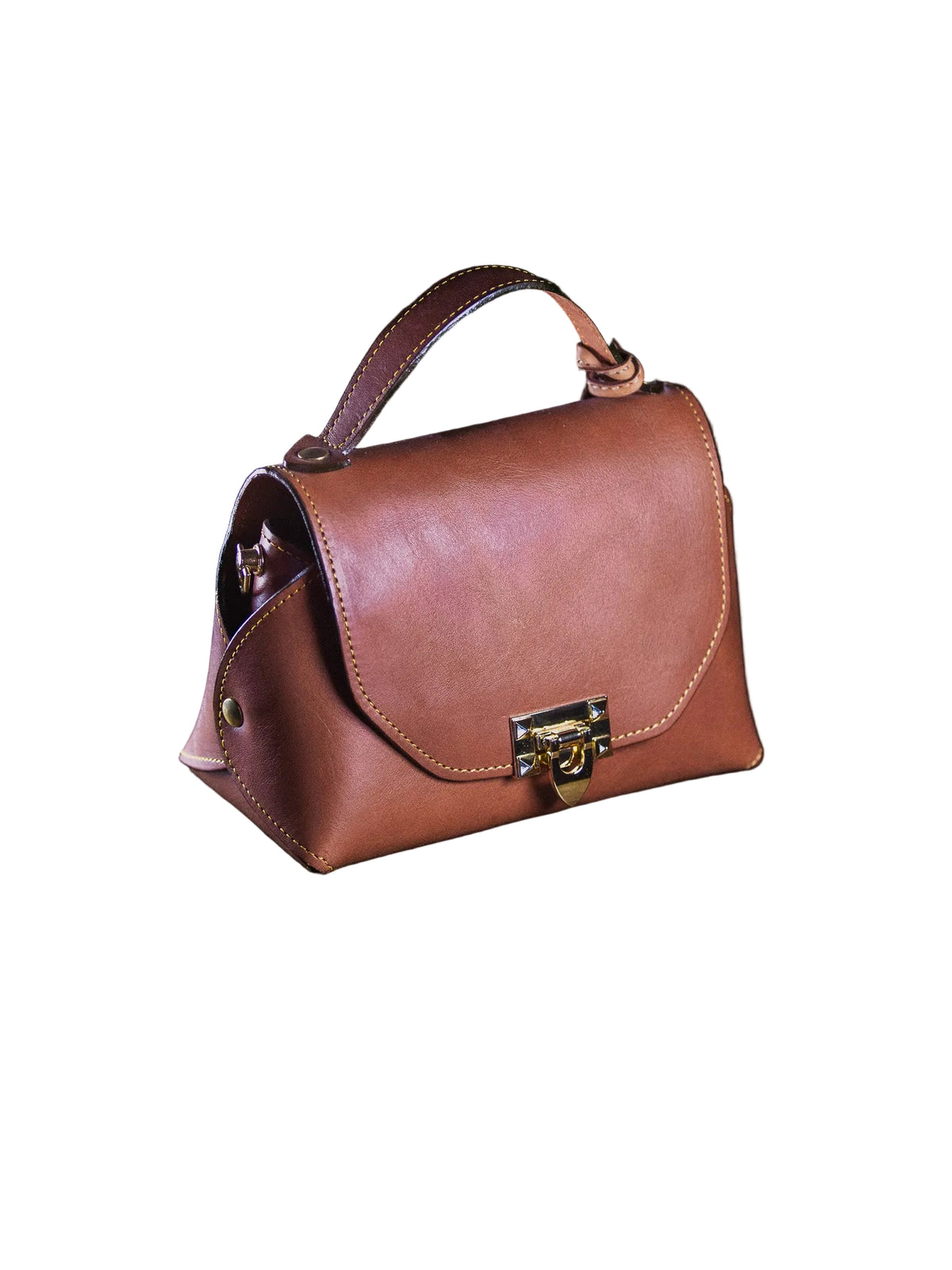 Brown leather handbag with a gold lock on a dark surface