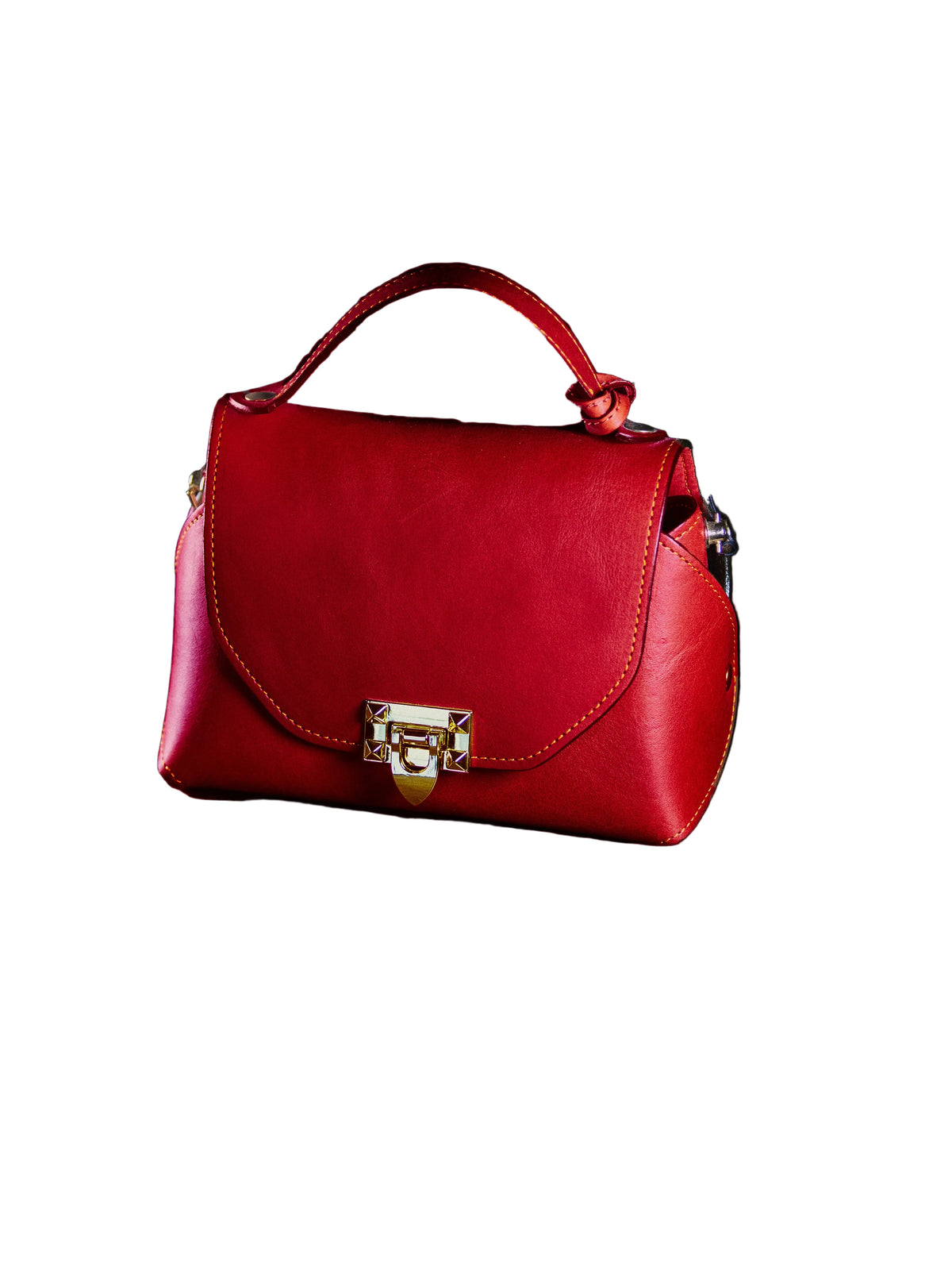 Redleather handbag with a gold lock on a dark surface