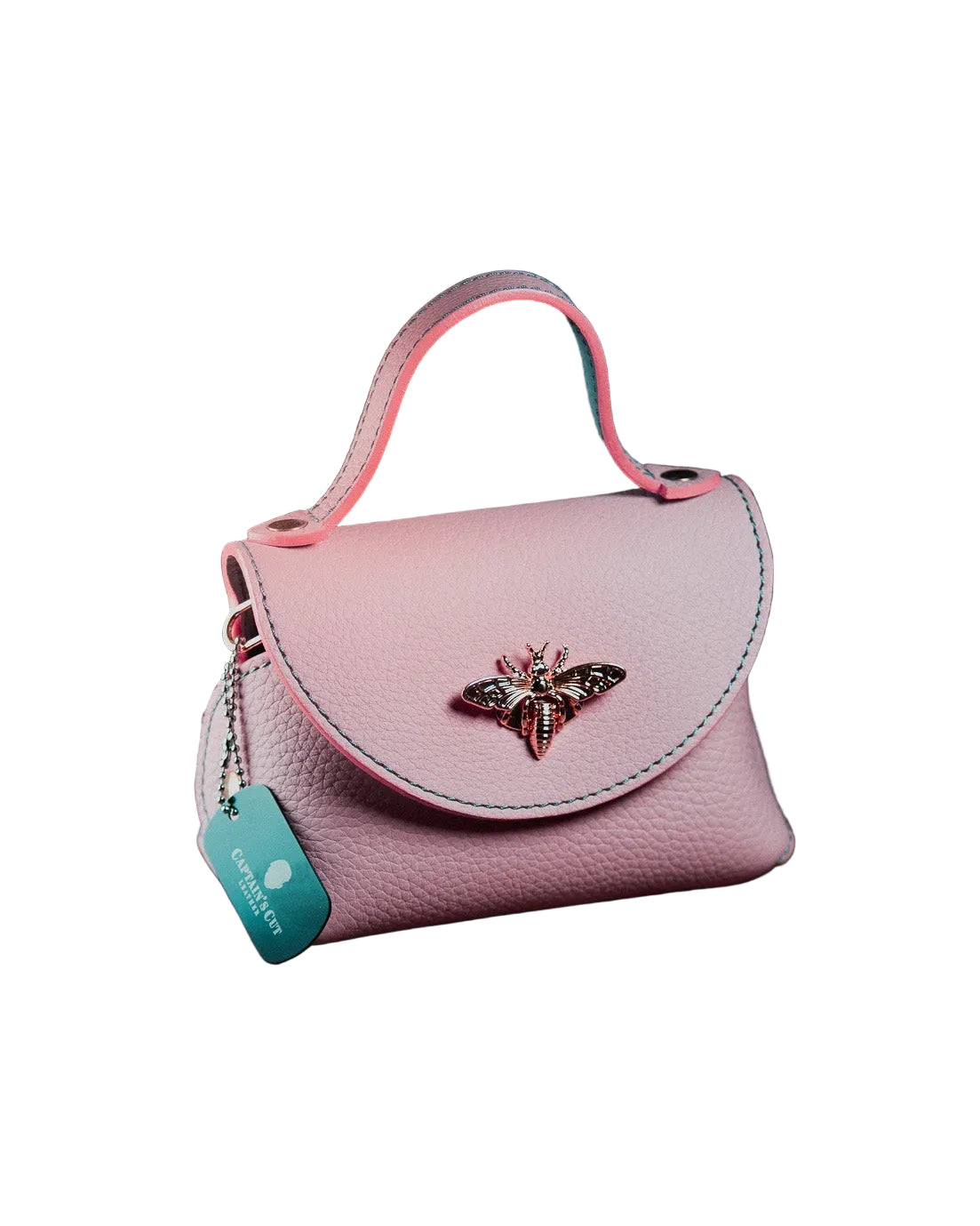 Pink micro handbag with a decorative emblem 