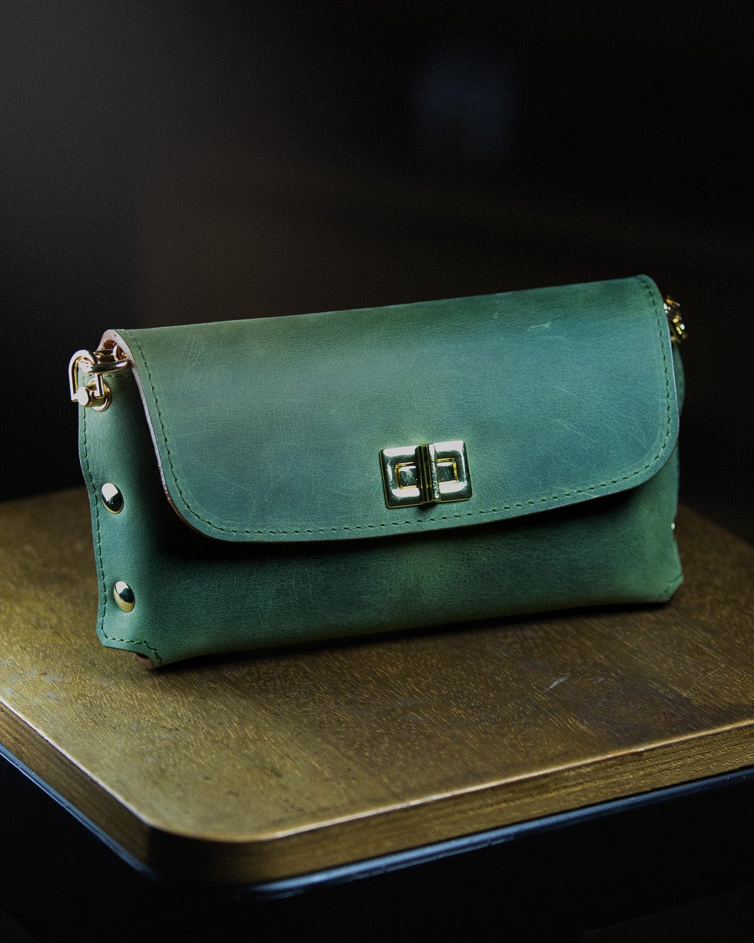 green leather clutch bag