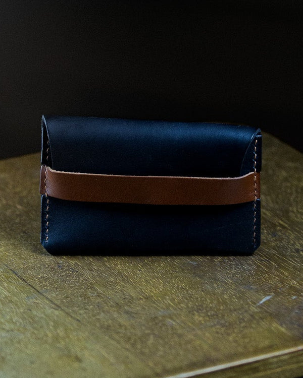 Navy blue leather wallet with brown accent