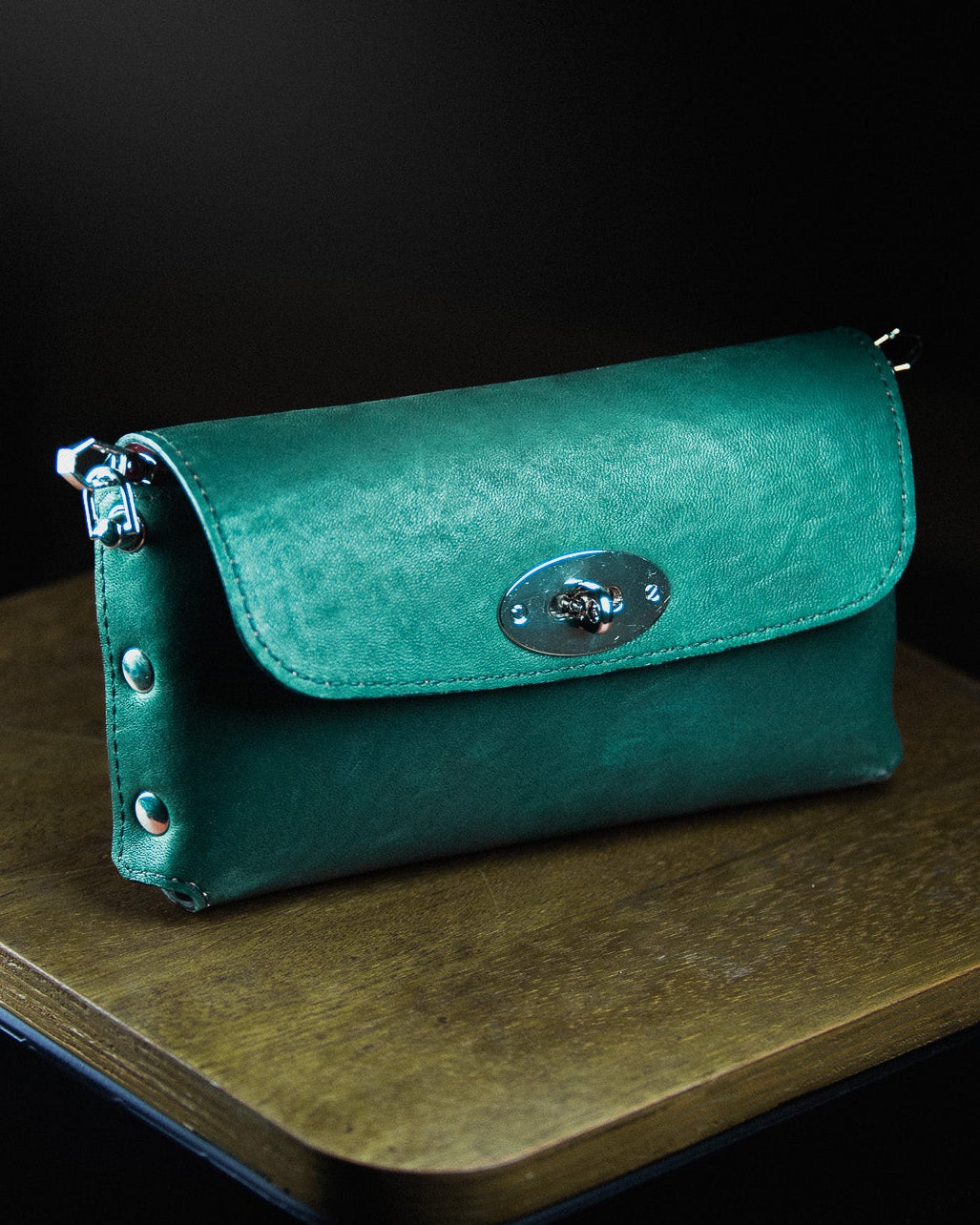 green/turquoise leather clutch bag