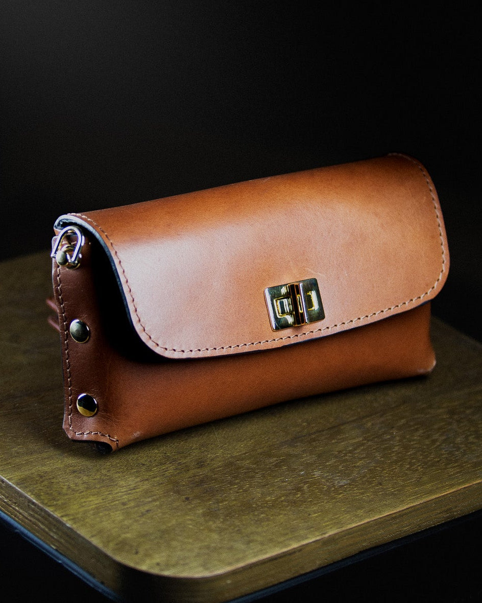 brown leather clutch bag from the side