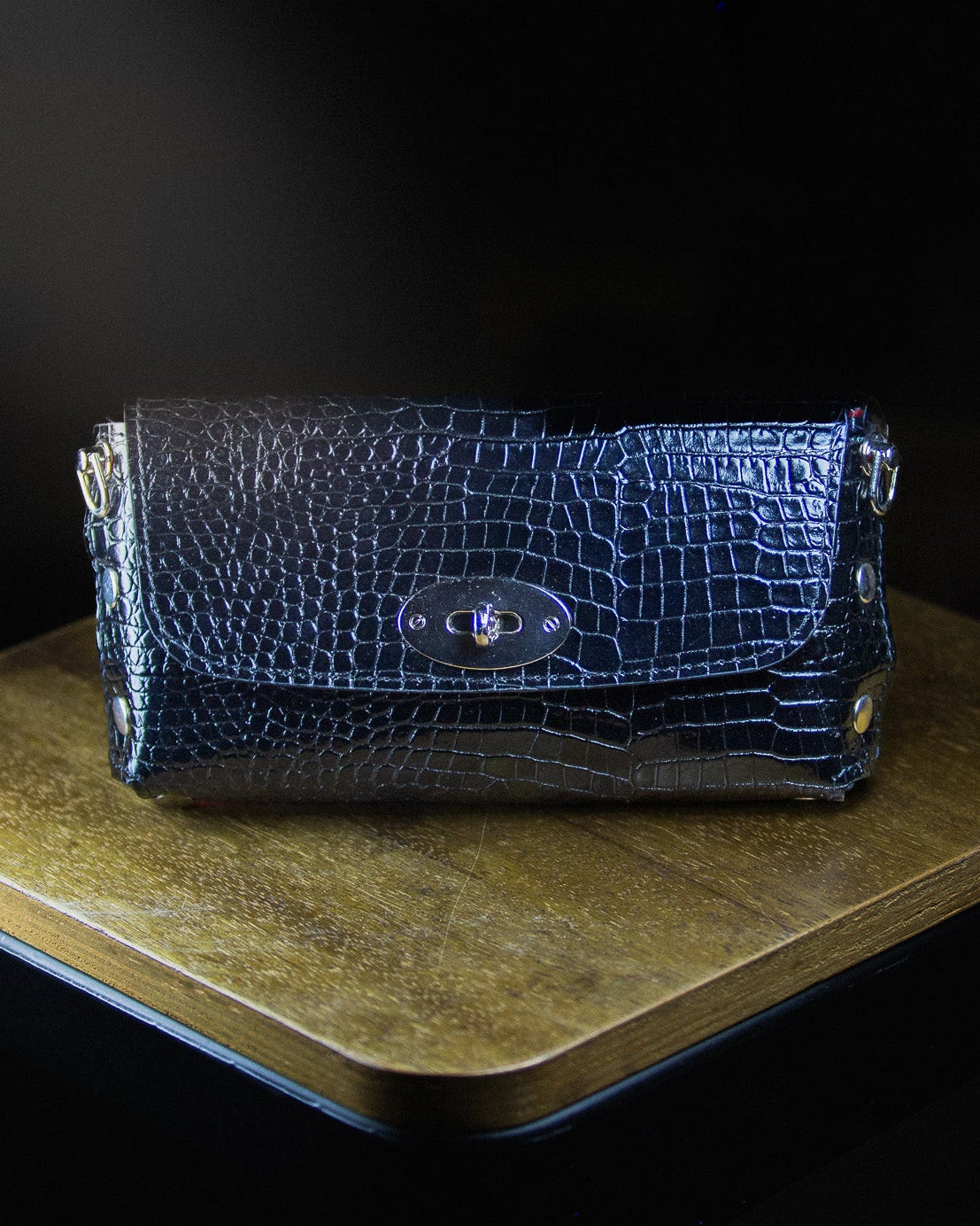 dark blue leather clutch bag