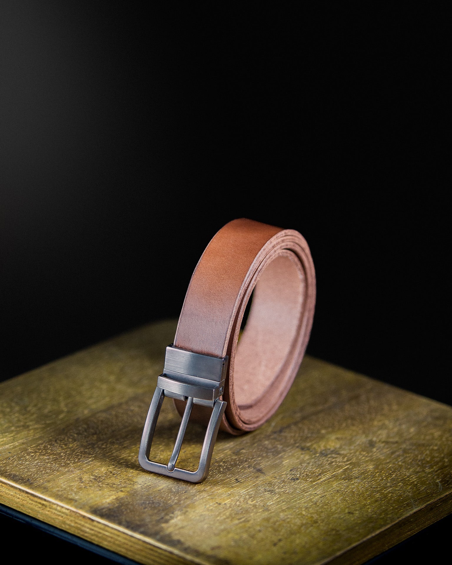 brown leather belt with matte chrome buckle