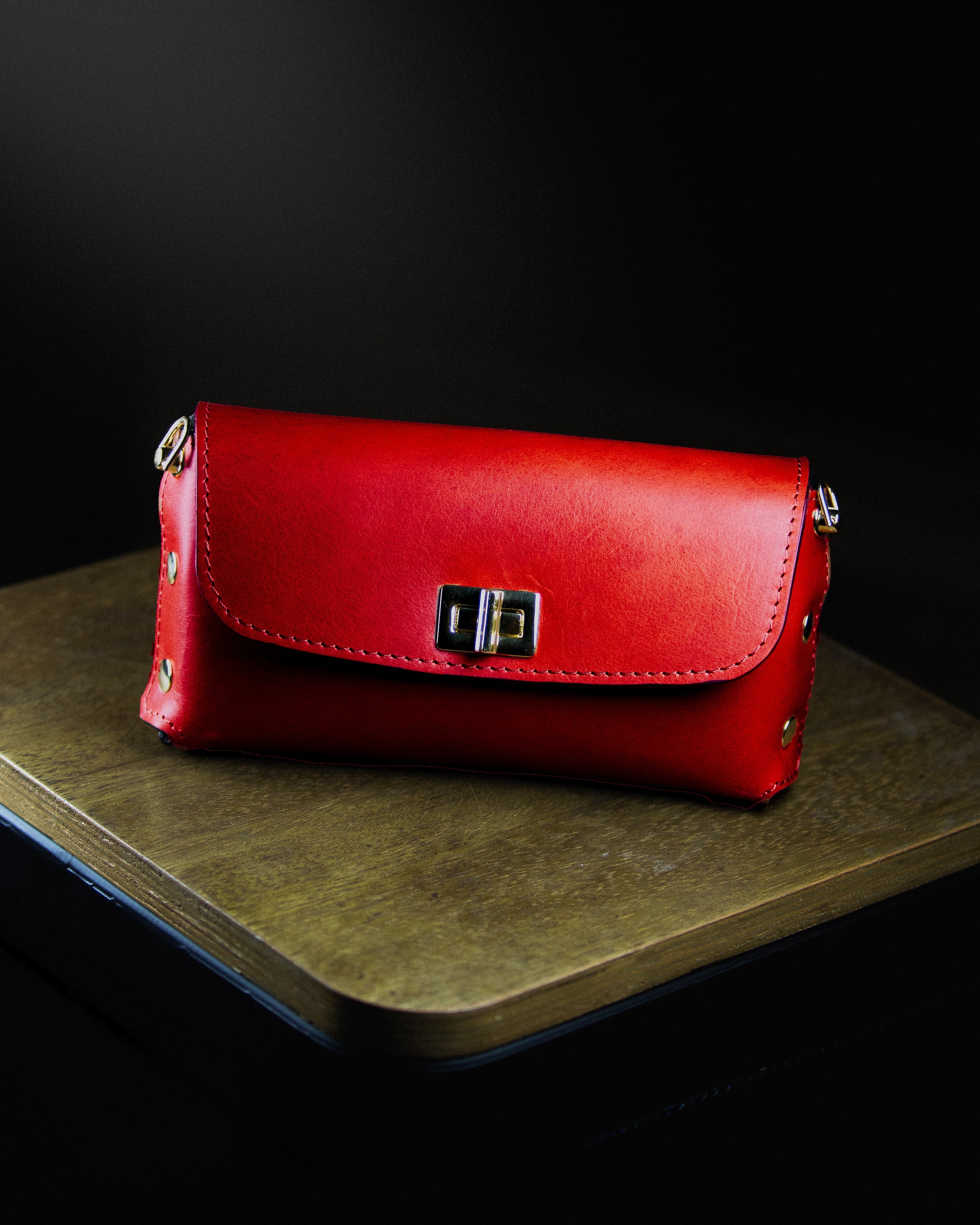 red leather clutch bag